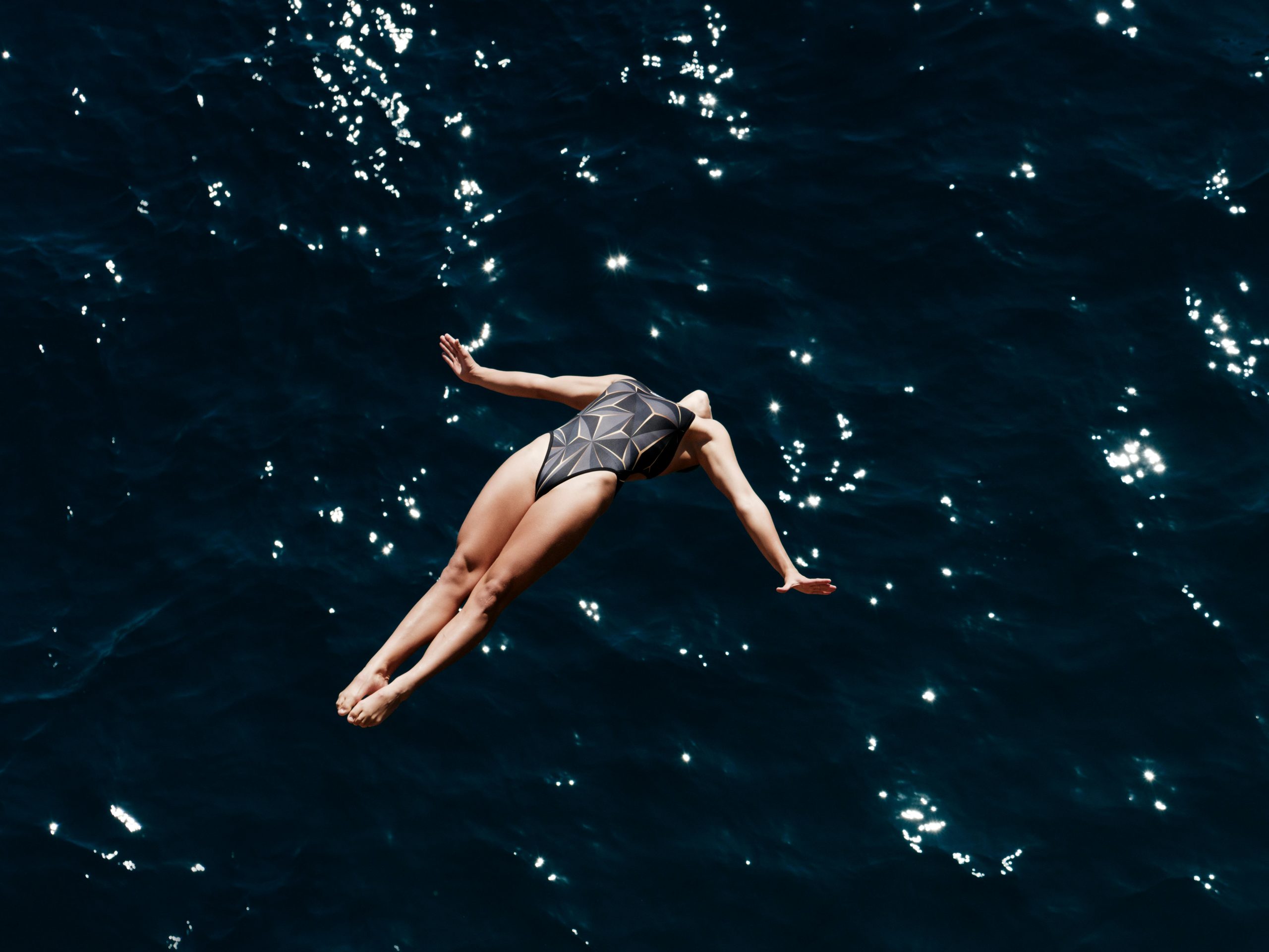 Woman diving into the ocean